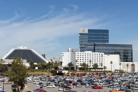 Crown Perth casino towers and pyramid theatre behind a full car park on a clear day